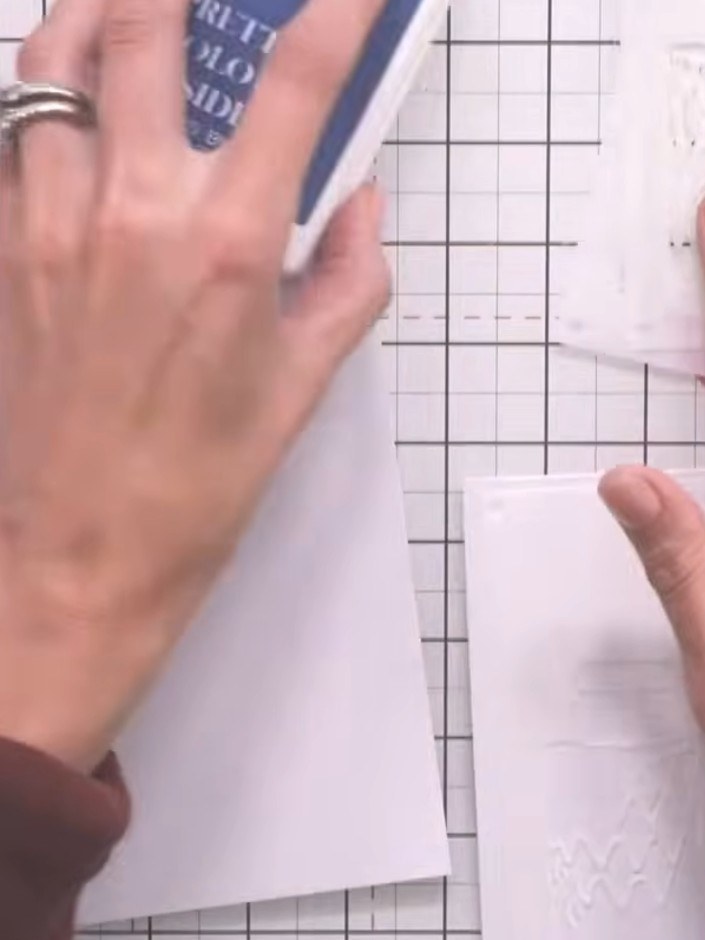 Step 1: Gather your white card stock and prepare two pieces for creating the two vases in this project.
