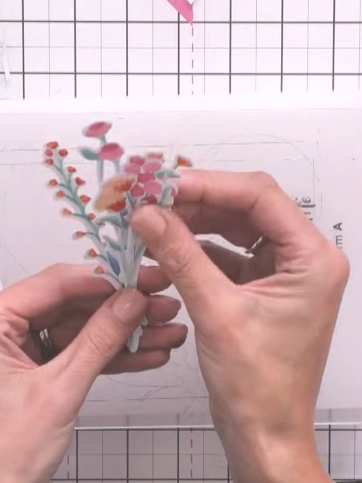 Step 12: Die-cut the vase pieces and arrange them on your card. Trim the foliage to fit inside the vase opening as need