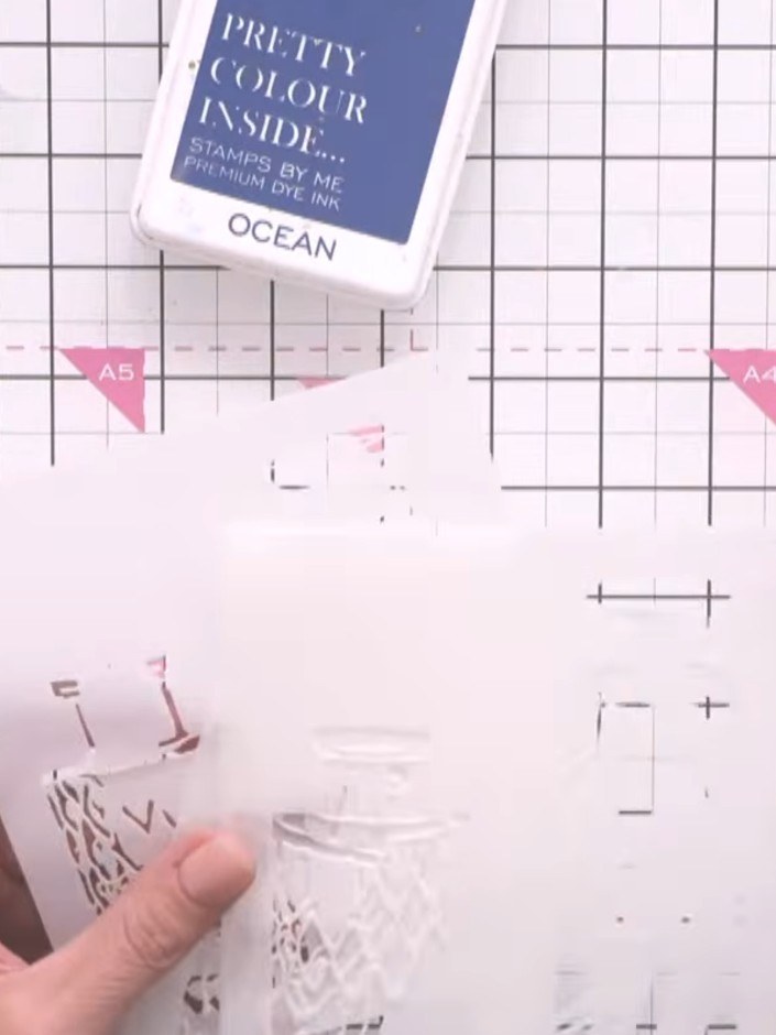 Step 2: Take the first foliage layering stencil (numbered one) and position it on your white card. Using Ocean ink, ge