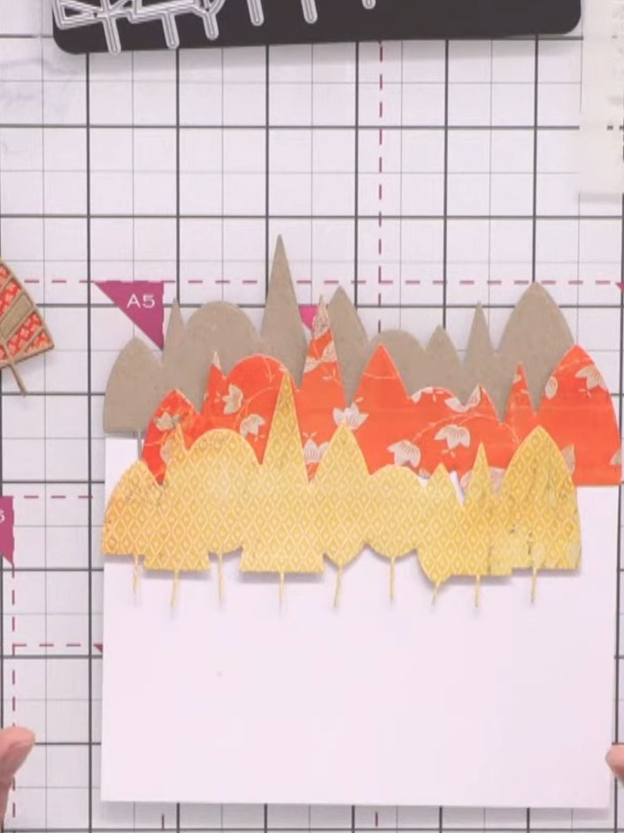 Stap 2: Die-cut the solid tree line again using yellow patterned paper from the Mellow Moments pad. This creates a sec