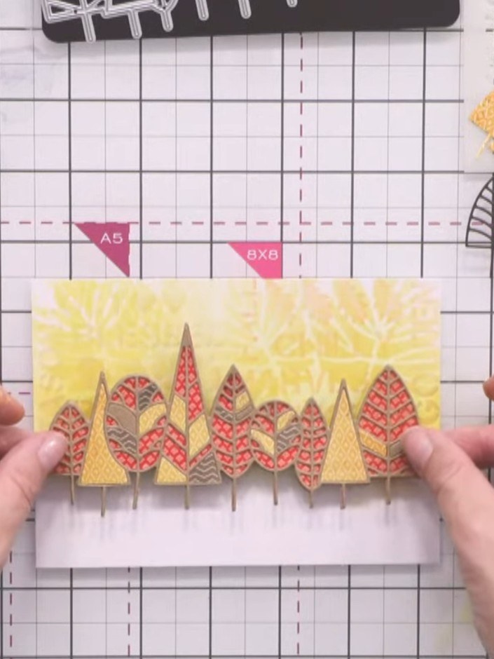 Stap 8: Mount the layered tree die-cut onto foam tape to add dimension to your card. Position it centrally on your car