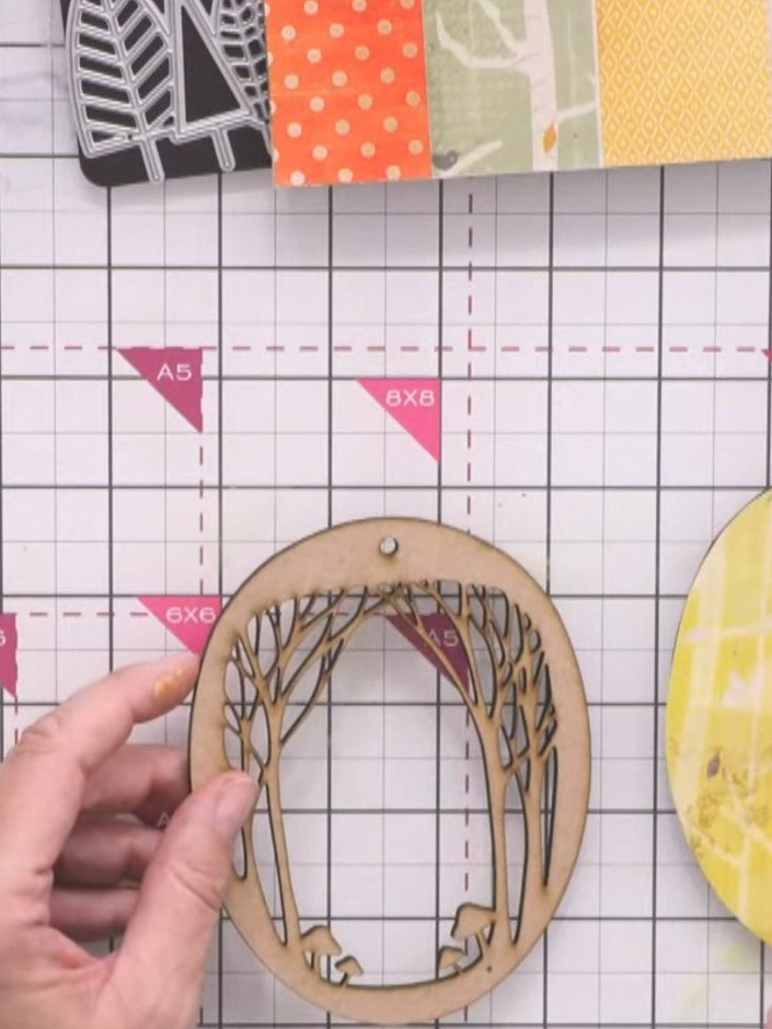 Step 4: Apply PVA glue to the solid MDF base piece and carefully position the cut patterned paper onto it. Smooth down