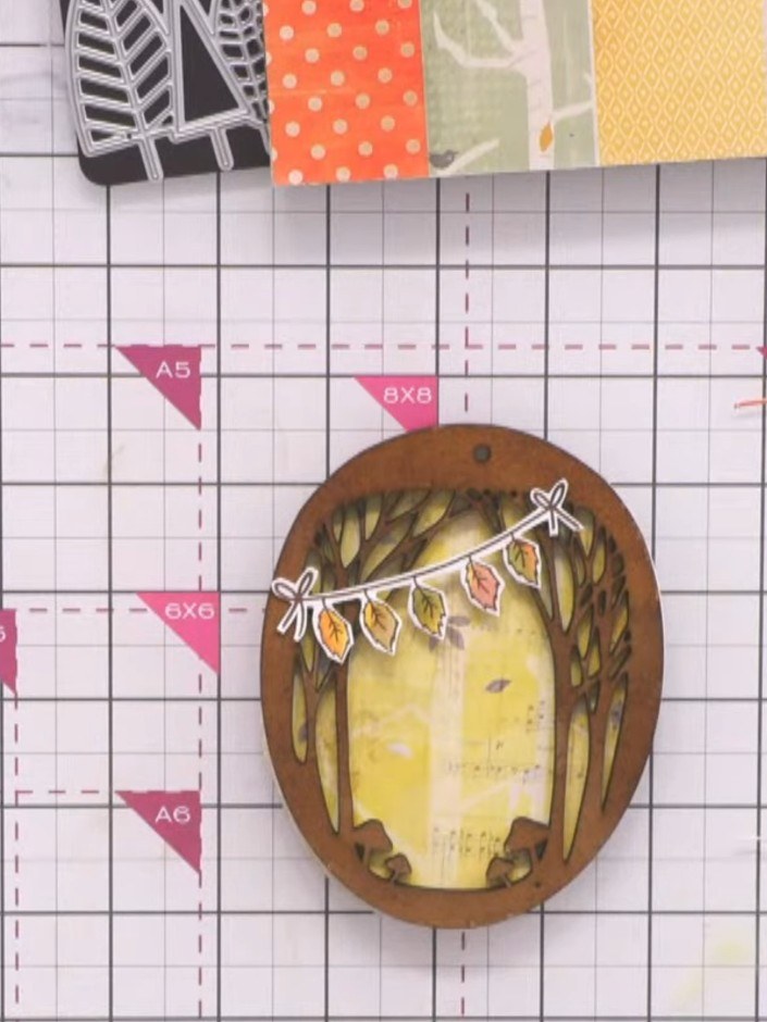 Step 8: Stamp a leafy garland image from the Falling for Autumn stamp set across the top of the decoration using okra 