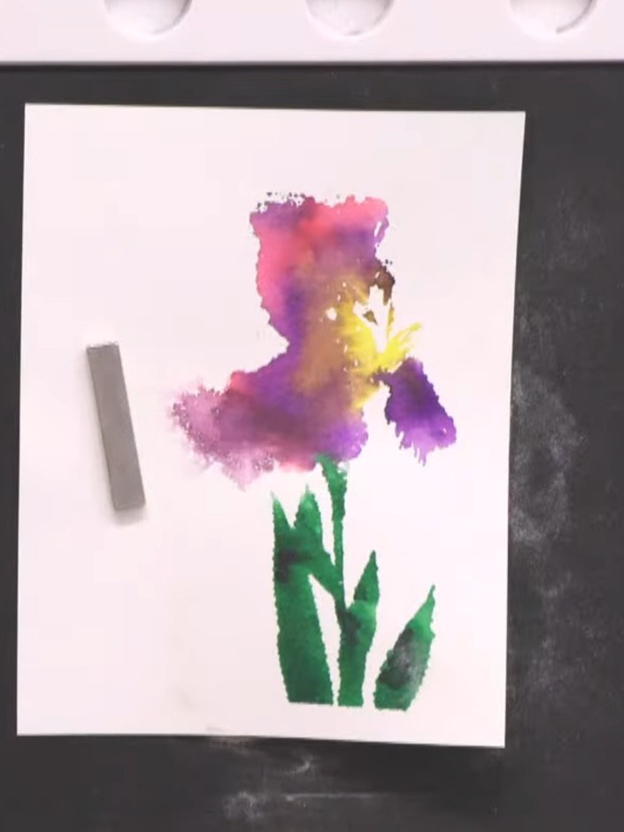Stap 8: Align the detailed outline stamp from the lamination stamp set over the watercolour iris image. Press the stam