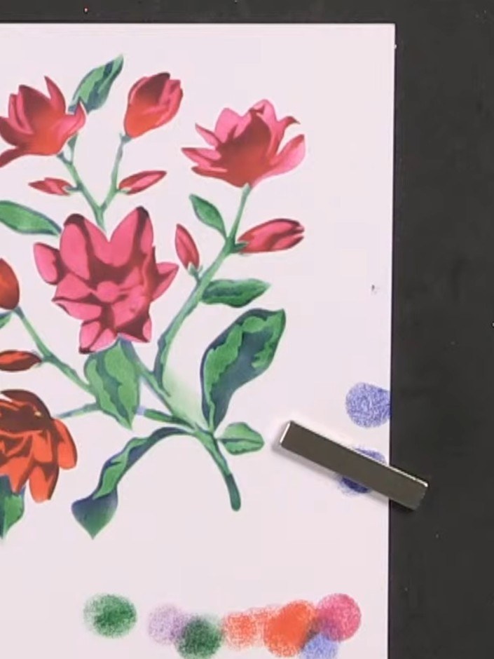Passo 7: Stamp the large coordinating floral stamp over your stencilled design using black ink. Position the stamp care