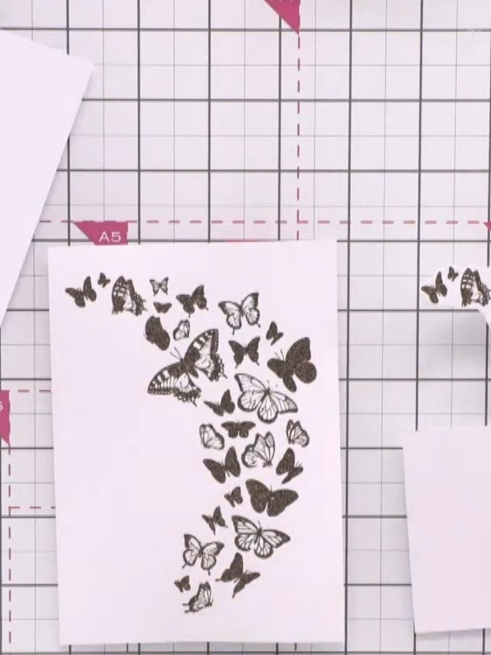 Passo 10: Spritz water into the lid of your confetti inks. Use a brush to apply colour to selected butterflies above the