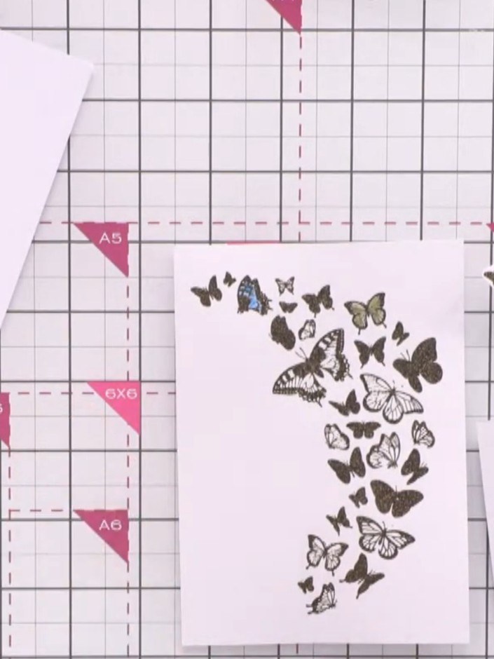 Passo 11: Cut out two individual coloured butterflies from the second embossed butterfly panel to use as floating elemen