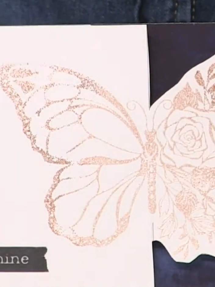 Passo 12: Optionally colour the butterfly wings using rich blue confetti inks to add depth and complement the dark backg