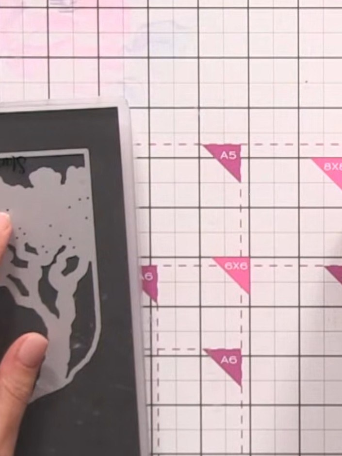 Step 6: Select the outside frame die from the Set the Scene die set. Use this die to cut a frame from pink cardstock t