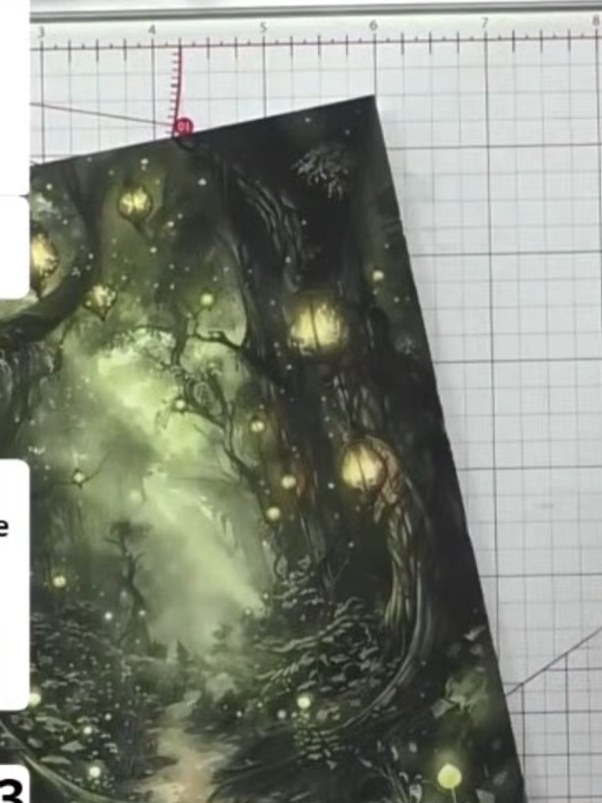Step 1: Select a patterned paper from your Mystic Hollow collection and place it into the embossing folder with the ra
