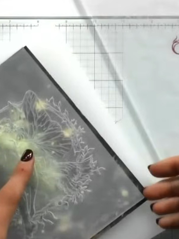 Step 4: Take a white ink pad and gently dab it across the embossed surface, using a light rattling motion to catch the