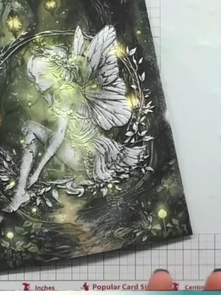 Step 8: Allow the glue to dry completely before displaying or sending your finished embossed fairy card.