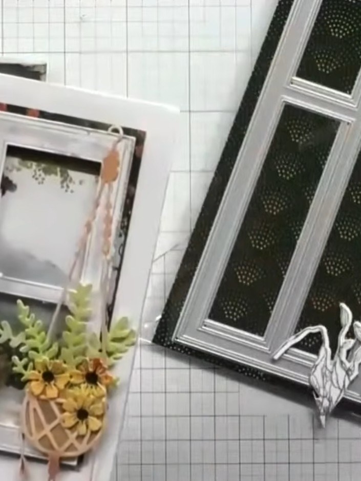 Step 5: Layer the white window die-cut frame onto your card base, positioning it to show the patterned paper through t
