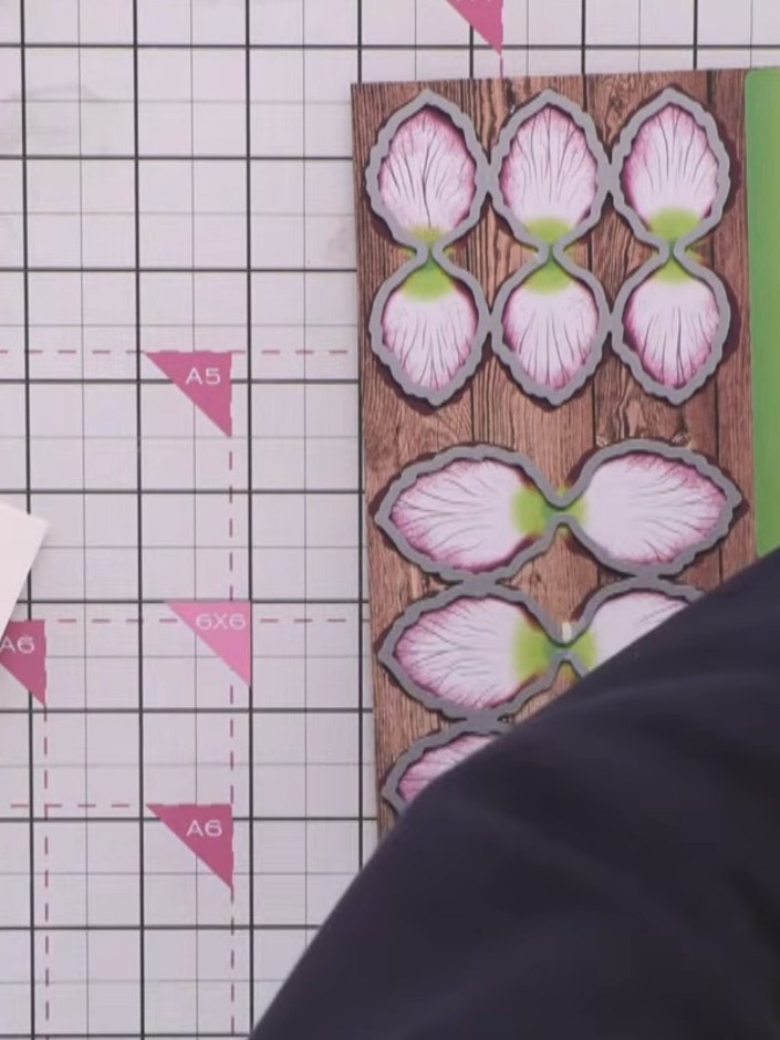 Step 3: Run the die set through your die-cutting machine in one pass to cut all three flower sizes and the accompanyin