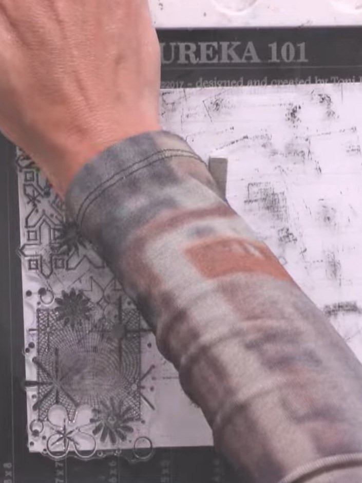 Step 2: Trim the stamped panel down using a craft cutter to create a smaller, more defined piece.