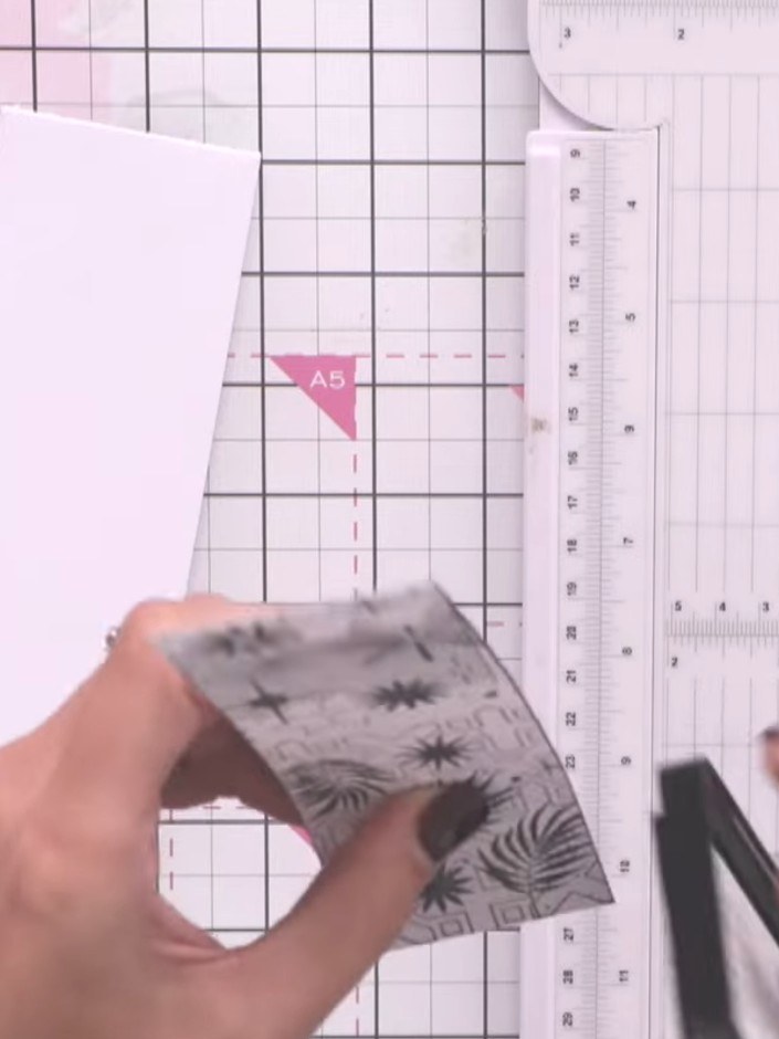 Step 4: Adhere the stamped and edged panel to your white card base using glue or double-sided tape, ensuring it is cen