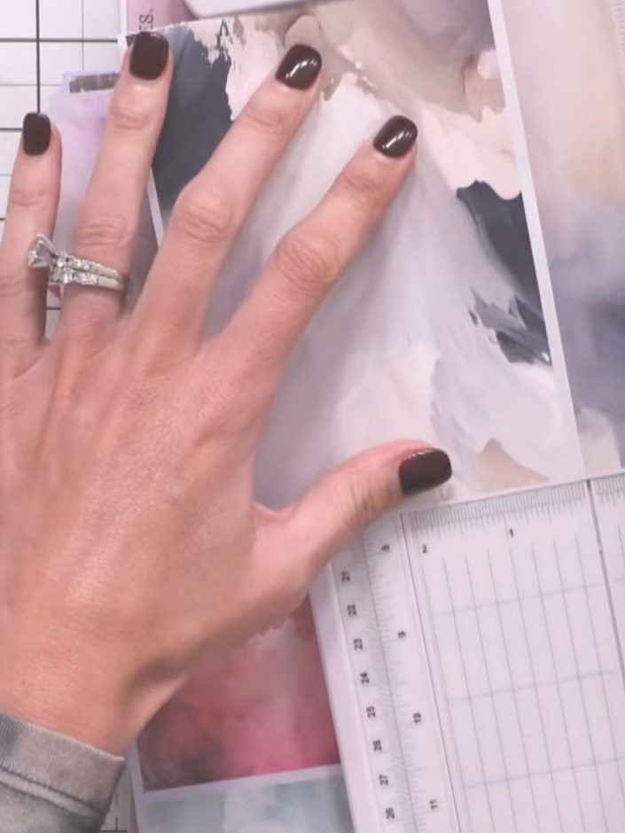 Step 5: Select patterned papers from the bundle in coordinating cream and coffee tones. Cut them to size using your pa