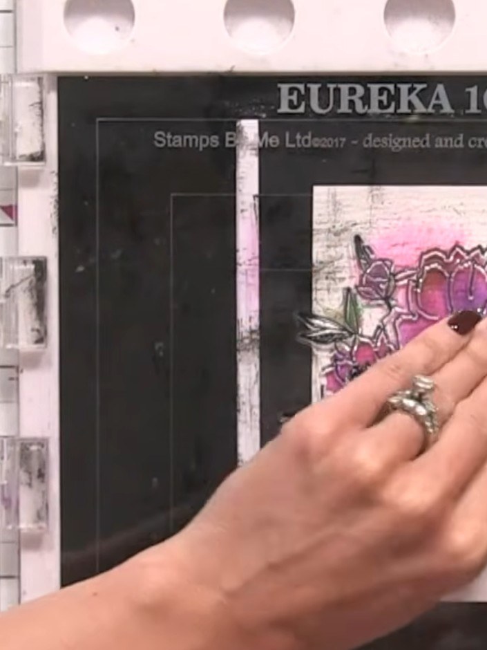 Step 10: Apply gold embossing powder over the stamped flower outline. Heat set the embossing powder using a heat tool t