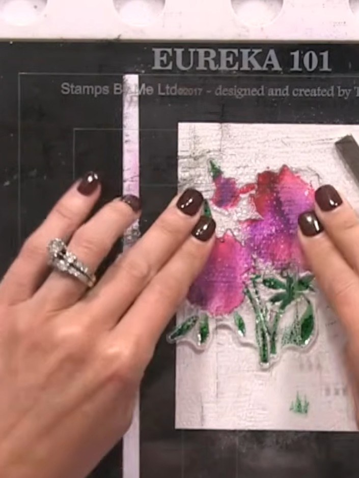 Step 4: Using a green ink pad, apply colour to all the leaf areas of the stamped floral design.