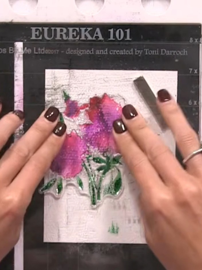Step 6: Whilst the card is still wet, use a brush to apply metallic gold watercolour paint to the centre of the flower