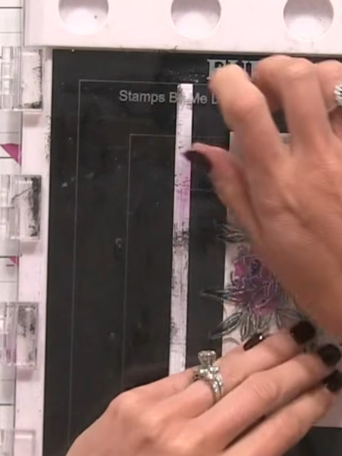 Step 9: Stamp the outline portion of the floral design using a black ink pad over the laminated image. Don't worry abo