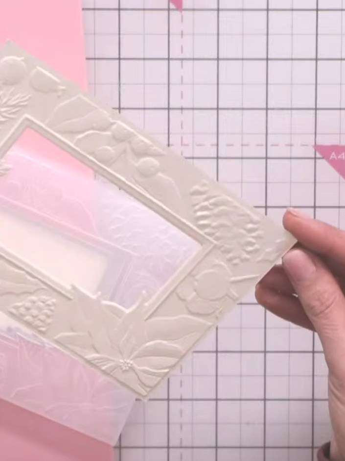 Step 3: Select a floral design from the Heavenly Blooms paper pad that complements the embossed window design. The deb