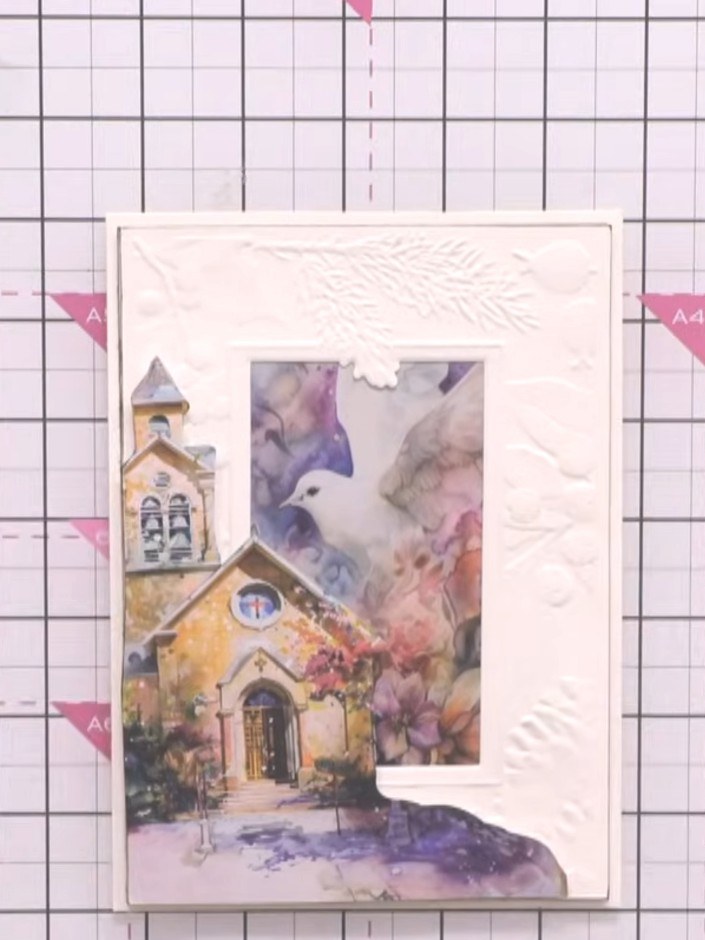 Step 7: Mount the embossed and inked panel onto a cream card blank using adhesive. Position it centrally to create you