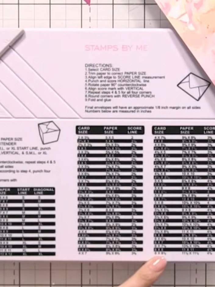 Step 1: Take a 12x12 sheet of cardstock and position it on your envelope board, aligning it to the XL line and the dia