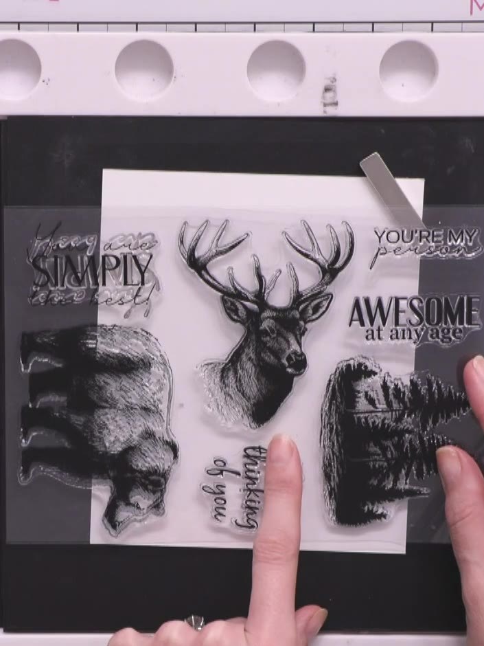 Step 1: Stamp the stag's head in black ink in the centre of your white cardstock. Position the stamp carefully to ensu
