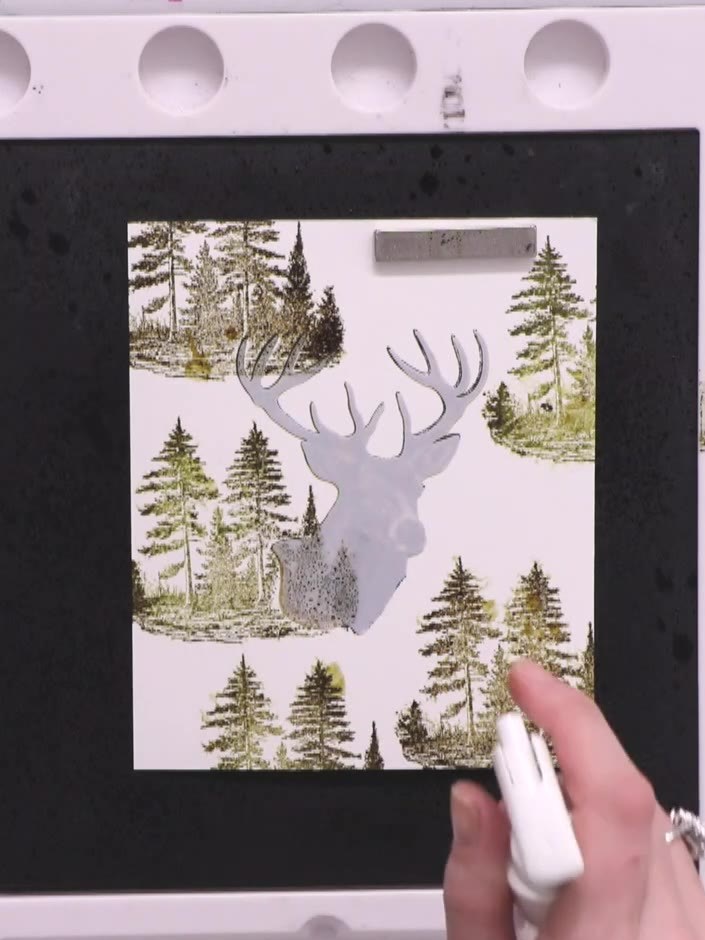 Step 5: Lightly spray the entire card with water using a spray bottle. This will push out the detail and create a dist