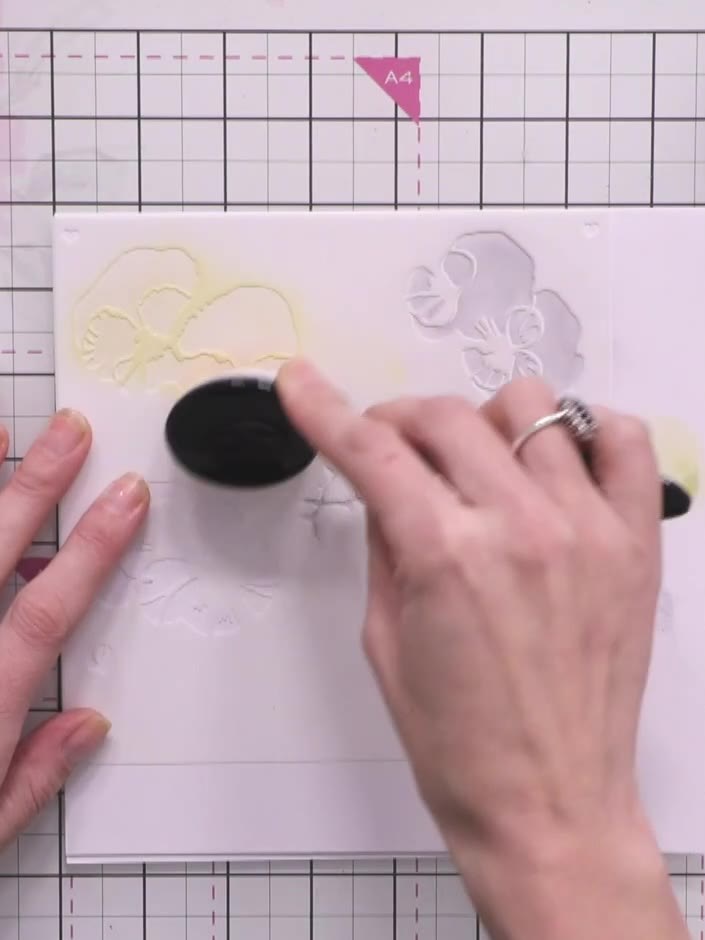 Step 3: Remove the first stencil and position the second stencil (number two) on your card, aligning it with the edge 