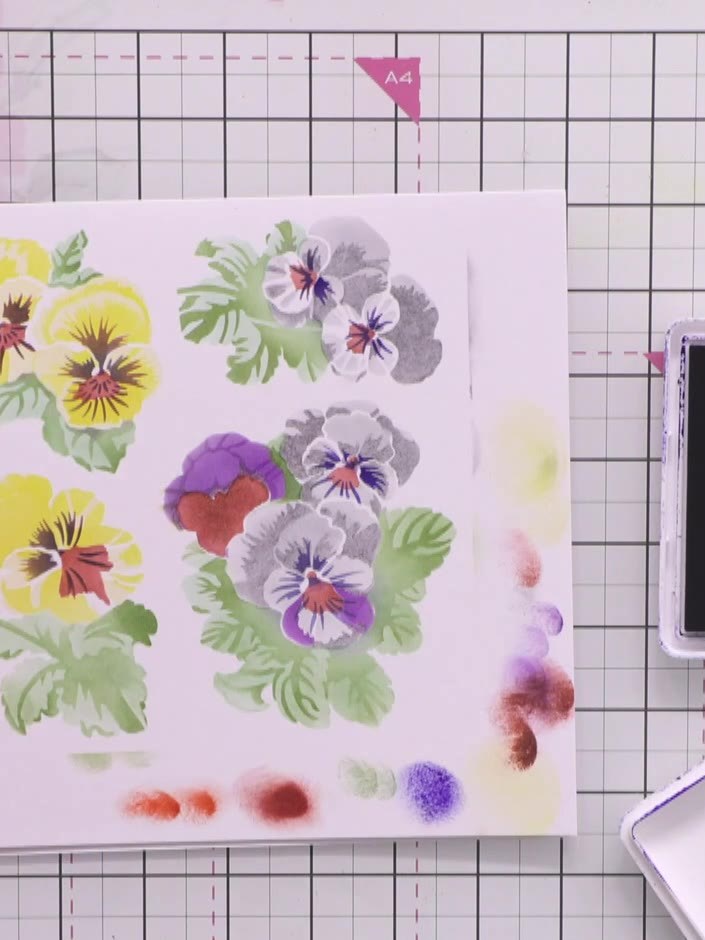 Step 9: Die cut your stencilled pansy card using the coordinating dies from the Poetic Pansies set. The dies will cut 