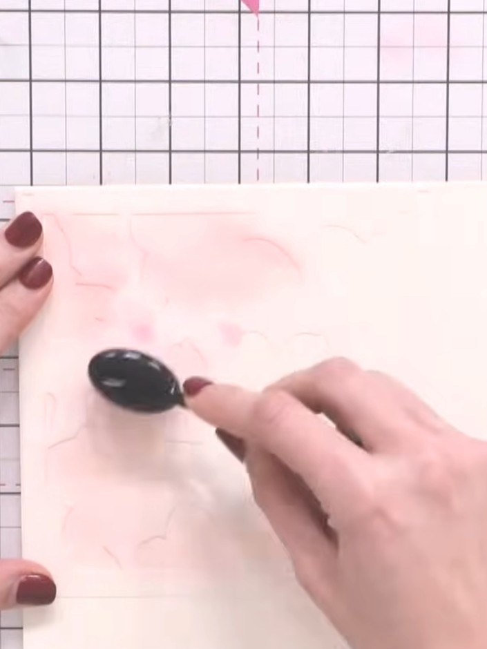 Step 2: Position the first stencil from the Magnolia Garden set over your card panel. Using a blending tool, apply pin