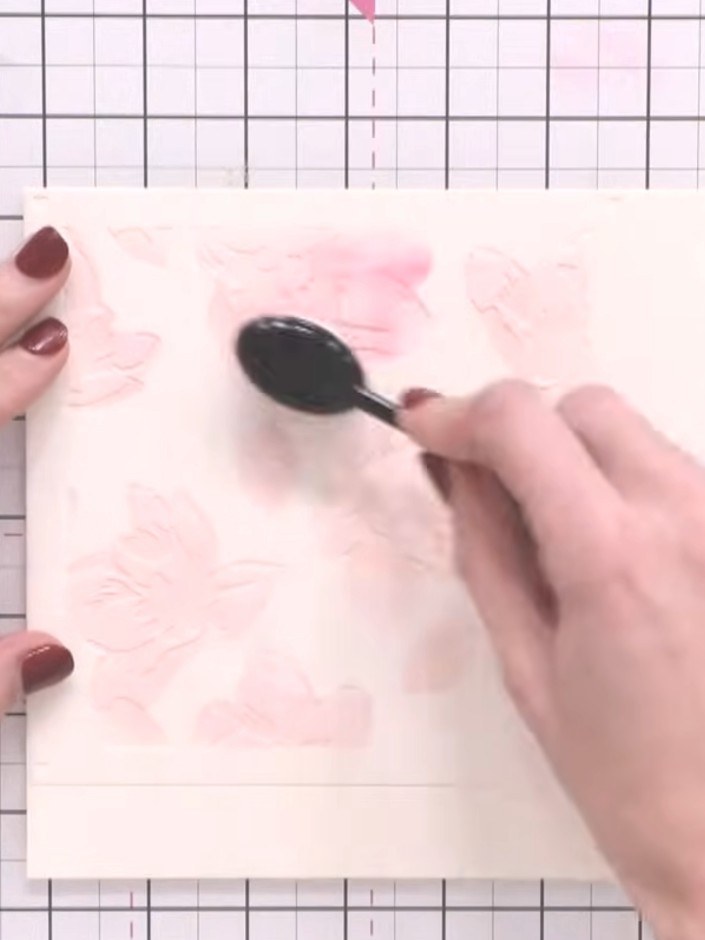 Step 3: Position the second numbered stencil over the first, aligning with the heart guides. Apply a darker shade of p