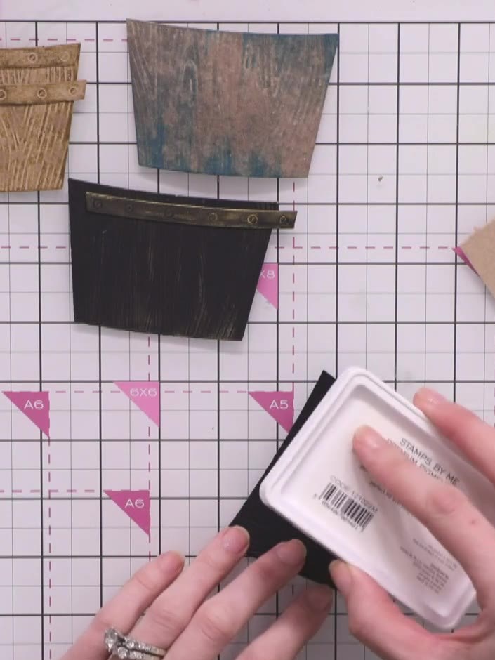 Step 7: Dip a white ink pad directly onto the black wooden crate to create a bold, contrasting finish. Press the ink p