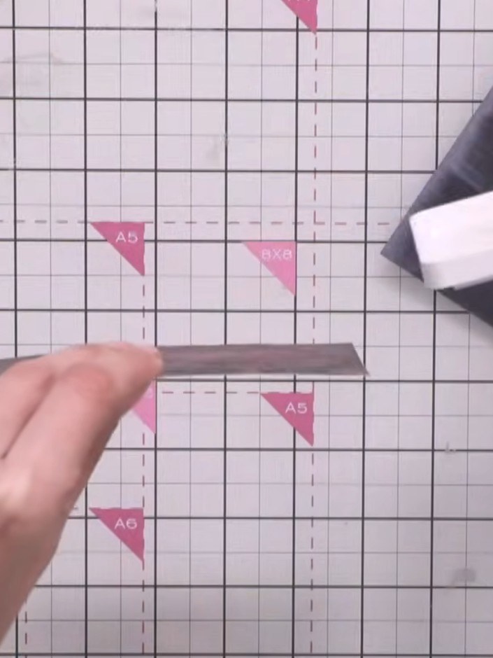 Step 4: Turn the card around and swipe the white ink pad from the bottom upwards across the village scene. This ensure