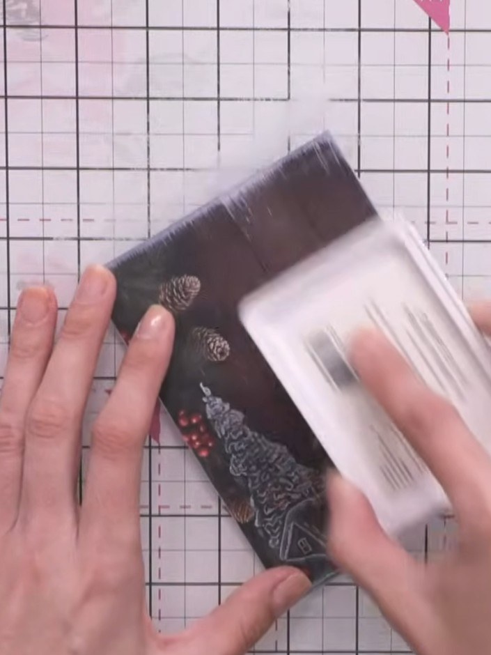 Step 6: Place the embossed panel onto your card base, working from the bottom up. Press firmly to ensure good adhesion