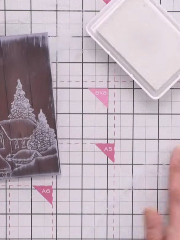 Step 7: Add glitter glue to the roofs of the houses and trees on your stamped image. Allow the glue to dry completely 