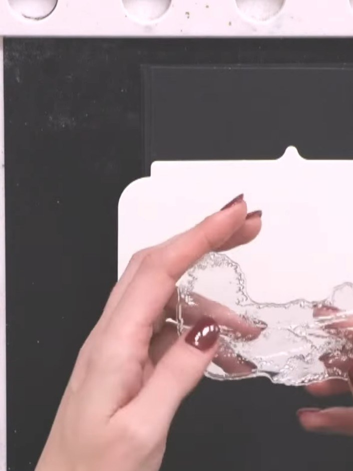 Step 2: Select the solid portion of the lamination stamp, which is the colour part featuring the tree design. This wil