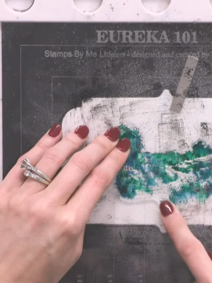 Step 3: Tap the stamp onto multiple ink pads in greens and teals, using random spots of colour for variation across th