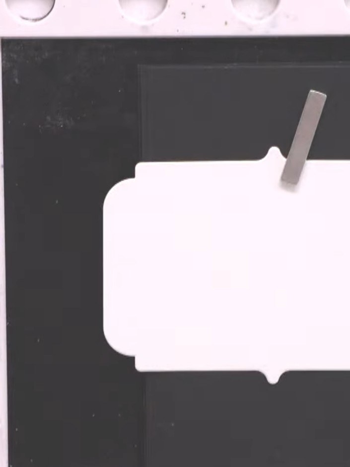 Step 4: Press the inked stamp firmly onto your white card stock. Spray the stamp with water and press it onto the card