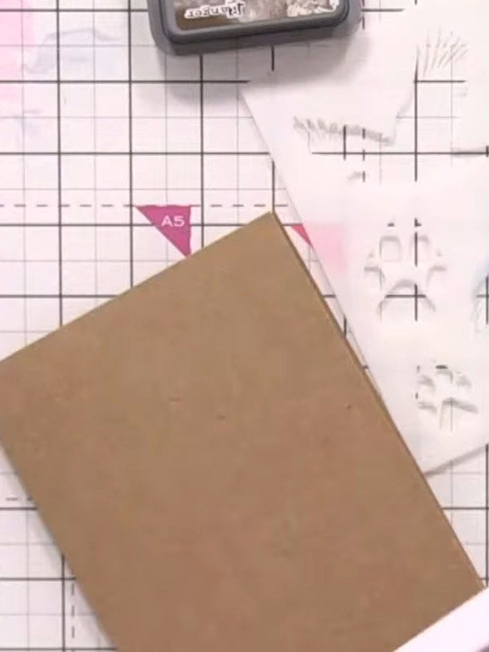 Step 4: Trim the inked panel down to a smaller size. Edge the panel with black ink using a Distress ink pad to remove 