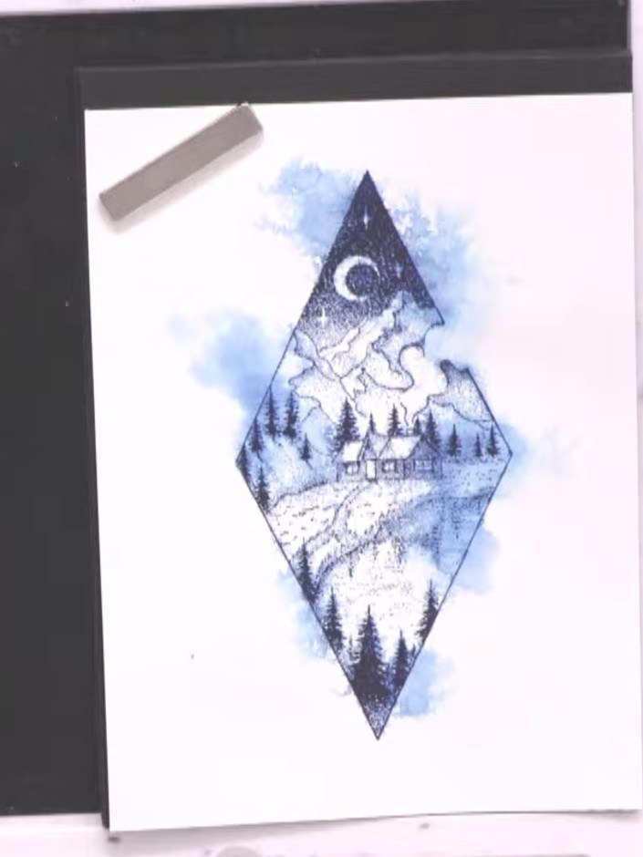 Step 8: Cut an aperture in a second piece of watercolour card the same size as your first card using a diamond-shaped 