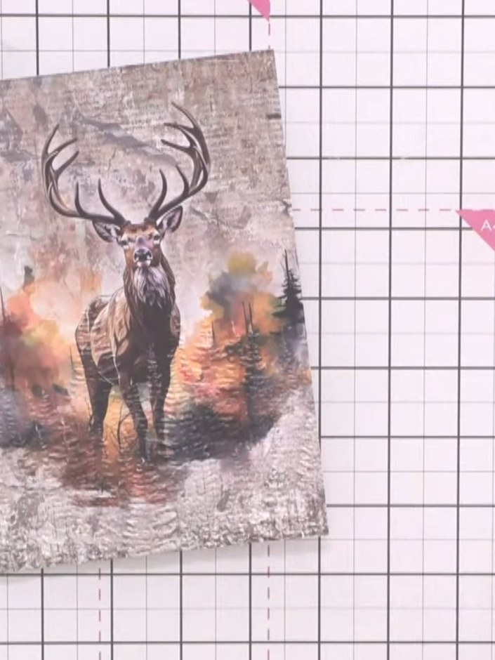 Step 4: Lightly tap the white pigment ink pad onto the embossed tree areas of the stag image to bring the trees into t
