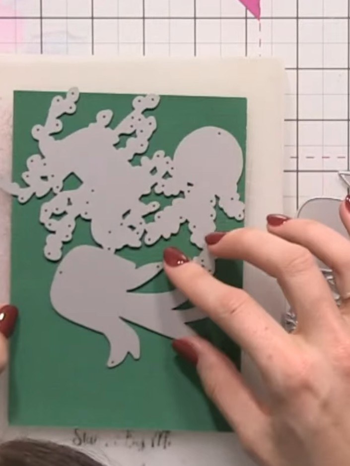 Step 2: Die-cut the same foliage pieces a second time using a darker green cardstock to create variation and depth in 