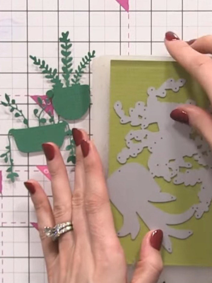 Step 4: Run the foliage dies through your die-cutting machine again using brown cardstock to create additional layers.