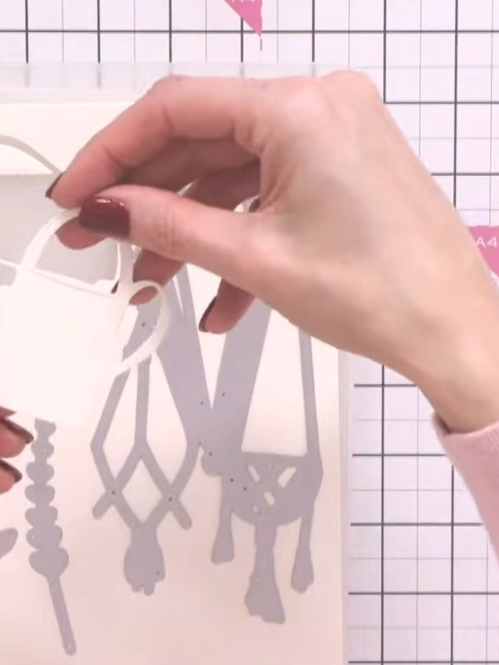 Step 1: Die-cut the hanging basket shapes from cream card stock using the Perfect Pots die set. Cut multiple pieces in
