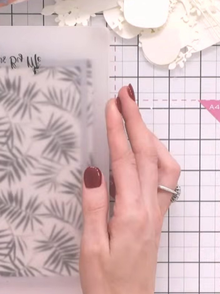 Step 4: Select a second patterned paper with a decorative scene. Die-cut this paper using the same or a complementary 