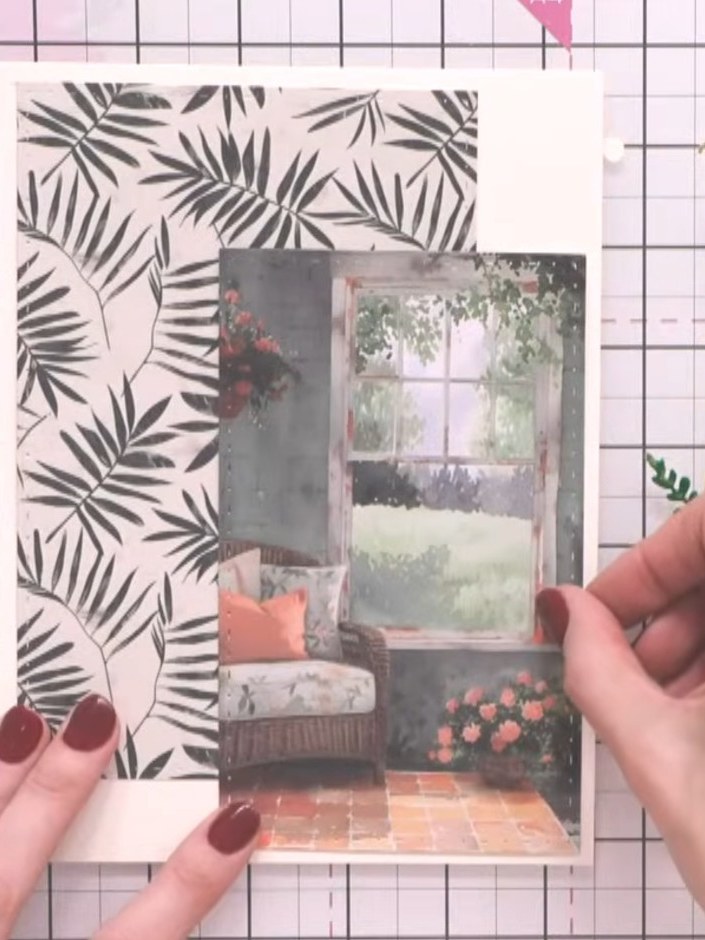 Step 8: Layer the palm leaf patterned paper onto the cream card base. Position the window scene topper in the centre o