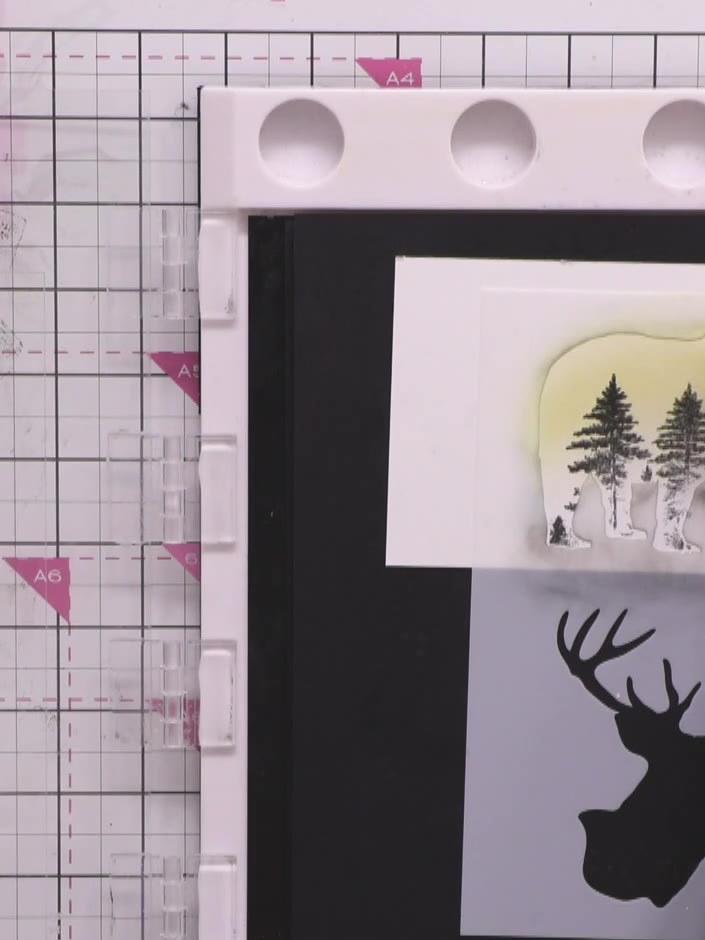 Step 10: Using the blending tool with Rusty Hinge Distress Ink, blend colour inside the bear stencil opening to create 